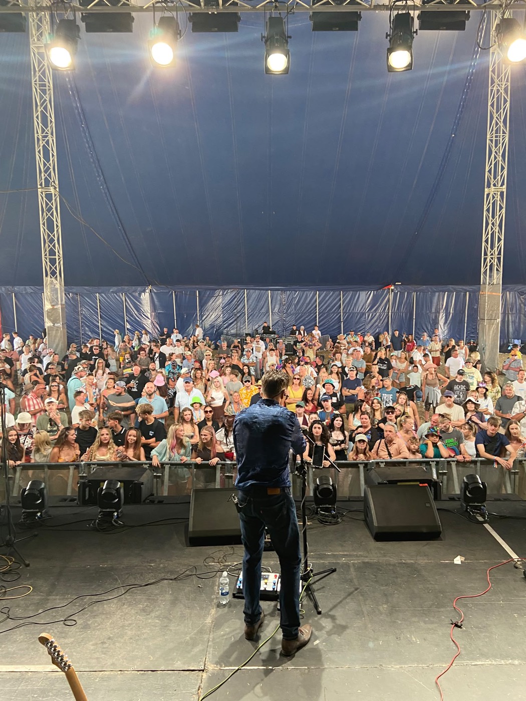 The Artificial Monkeys playing to a packed tent at Poole Harbour Festival, crowd from barrier to back of the tent